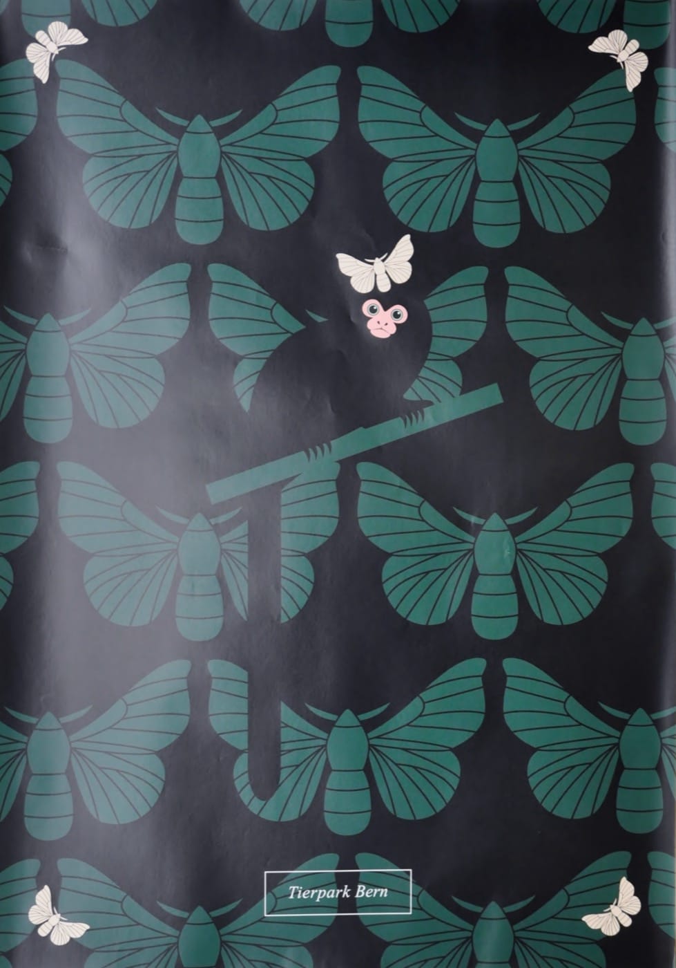 Affe und Schmetterlinge in grün
